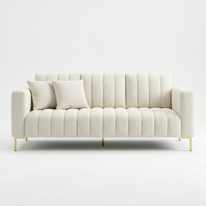 Cream boucle fluted sofa with gold legs on a white background