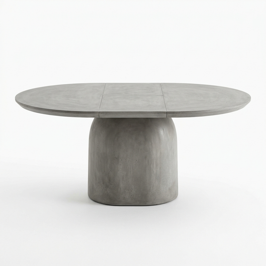 Concrete grey extendable pedestal dining table on a white background