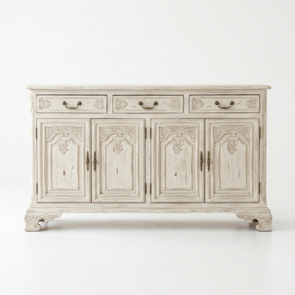 Distressed white French country sideboard on a white background