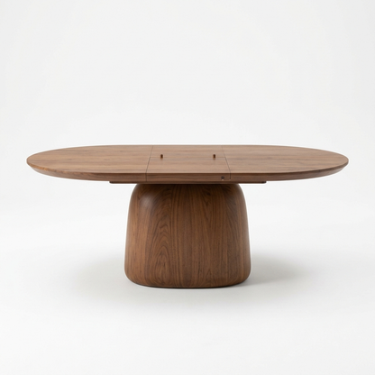 Warm walnut extendable pedestal dining table on a white background