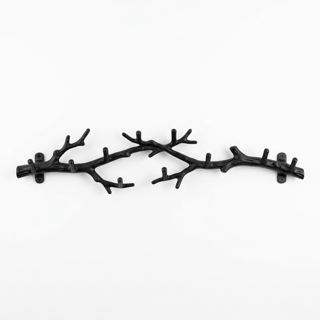 Black tree-branch wall-mounted coat rack on a white background