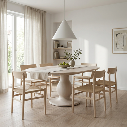 Whitewash extendable pedestal dining table styled in a room setting